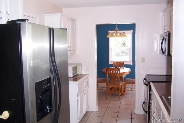 30 Cole Lane Rutherfordton, NC 28139 - Photo 13 of 24 a dining room with furniture and a refrigerator