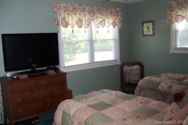 30 Cole Lane Rutherfordton, NC 28139 - Photo 16 of 24 a bedroom with a bed and a flat screen tv