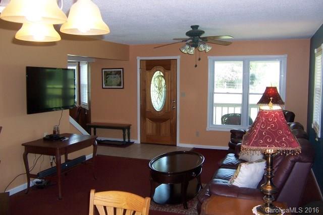 30 Cole Lane Rutherfordton, NC 28139 - Photo 10 of 24 a living room with furniture a window and a chandelier