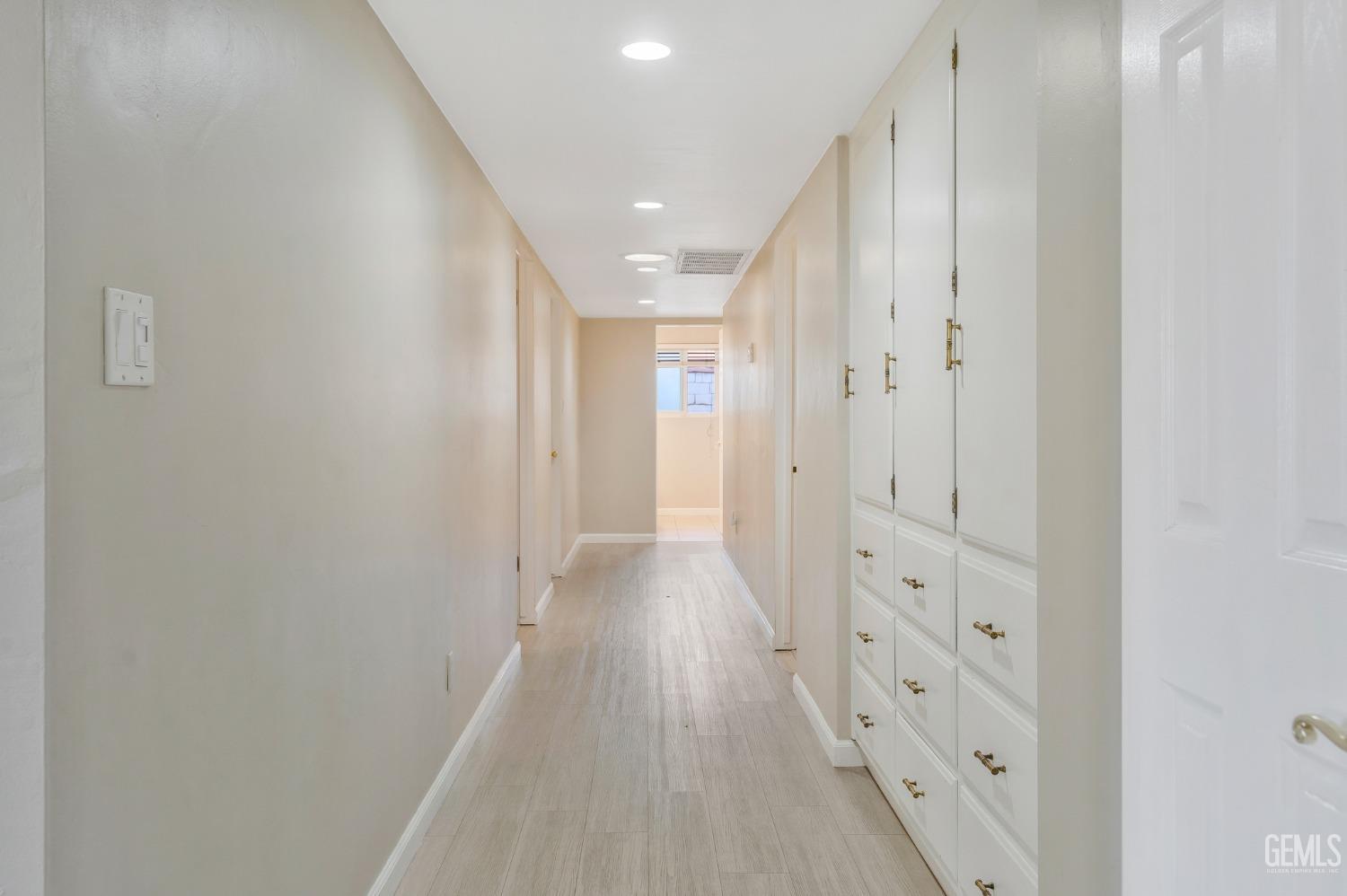 Undisclosed Address Bakersfield, CA 93306 - Photo 25 of 40 a view of a hallway with wooden floor