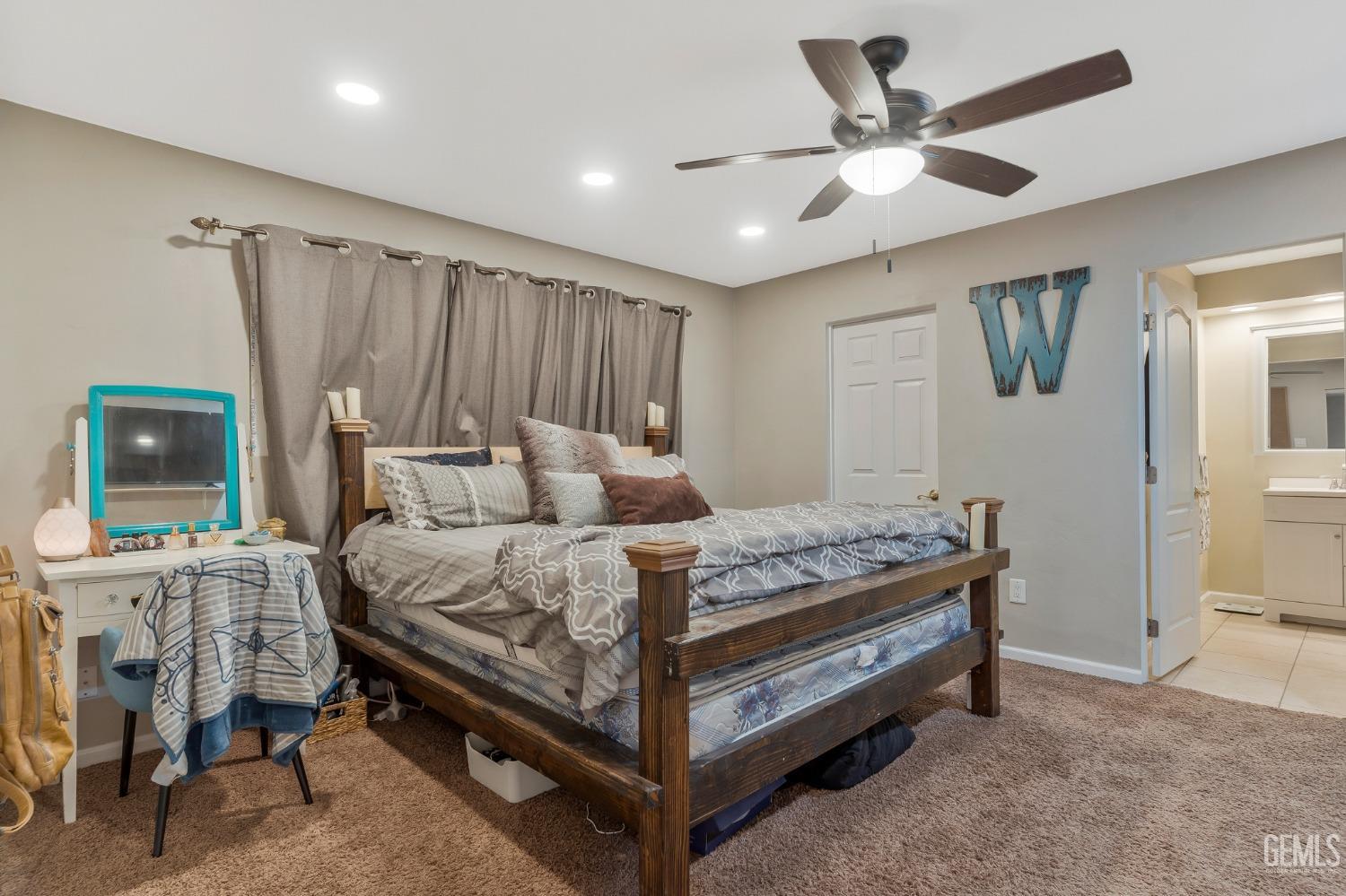 Undisclosed Address Bakersfield, CA 93306 - Photo 27 of 40 a bed room with a bed and a window