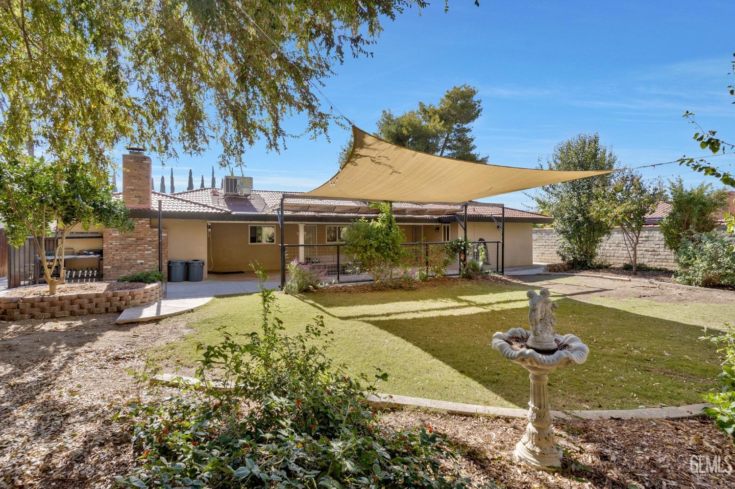 Undisclosed Address Bakersfield, CA 93306 - Photo 31 of 40 a swimming pool with yard in front of it