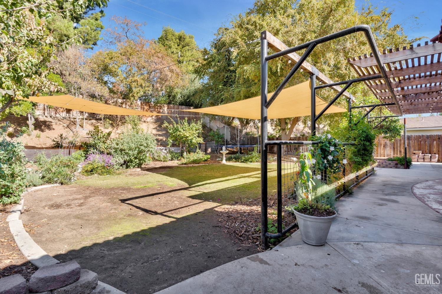 Undisclosed Address Bakersfield, CA 93306 - Photo 34 of 40 a view of a backyard with large trees