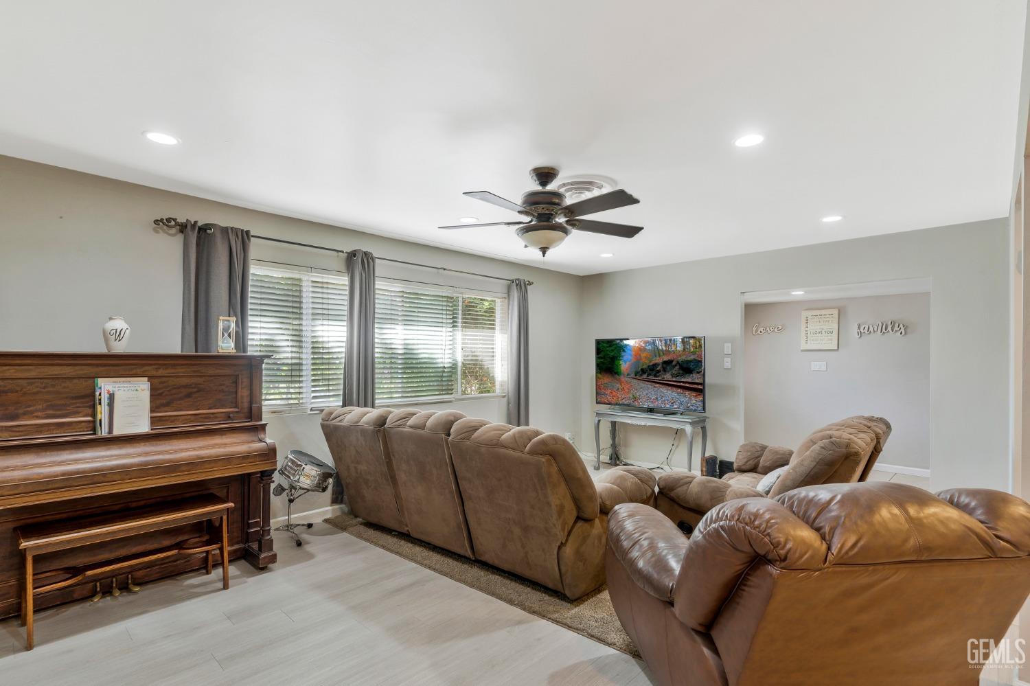 Undisclosed Address Bakersfield, CA 93306 - Photo 6 of 40 a living room with furniture and a window