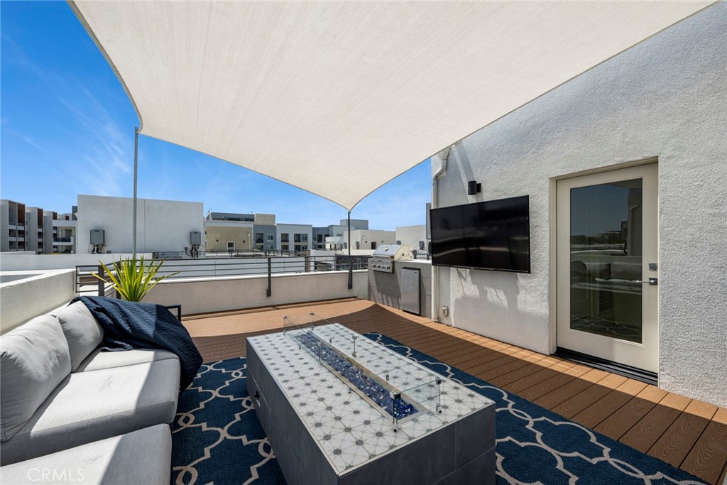 Roof top deck with firepit, tv and built in BBQ