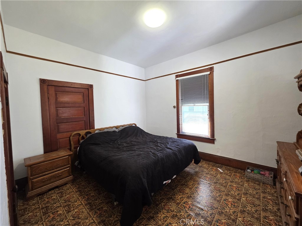 1414 Marin Street Corning, CA 96021 - Photo 24 of 43 a bedroom with a bed and a window