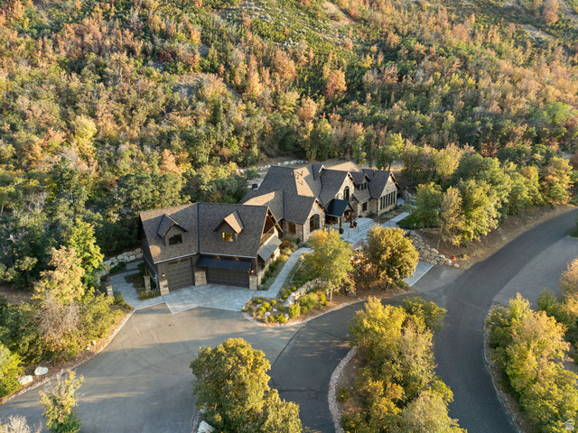 1141 South Oak Leaf Lane Springville, UT 84663 - Photo 135 of 147 Expansive property featuring a stone and wood-sided exterior, dark shingle roof, multiple gables, and an attached two-car garage