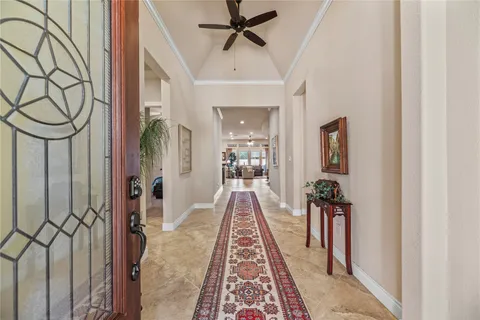 a view of a hallway with a chandelier