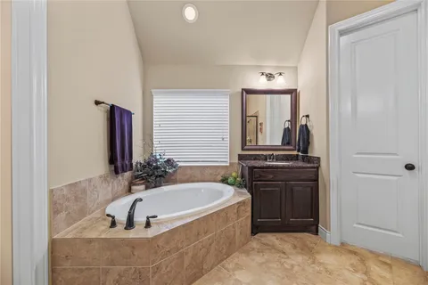 a bathroom with a bathtub and a sink