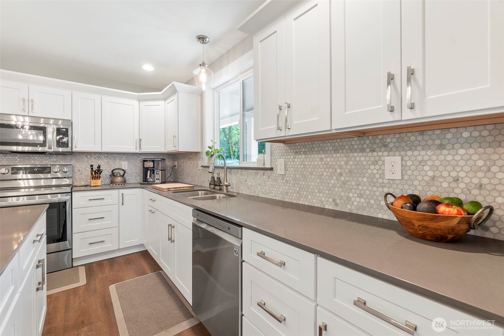 108 Timberline Lane Winlock, WA 98596 - Photo 11 of 20 a kitchen with stainless steel appliances granite countertop a sink a stove and white cabinets