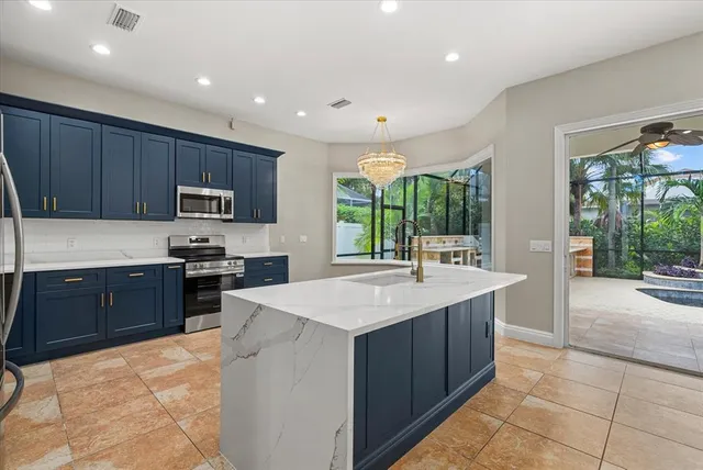 a kitchen with a refrigerator and cabinets