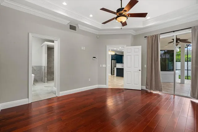 a bathroom with a granite countertop toilet a sink and a mirror