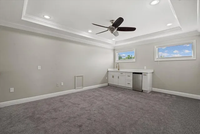 a utility room with a sink a vanity and window