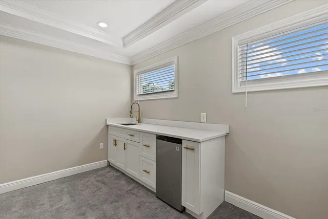 a bedroom with a large bed and furniture