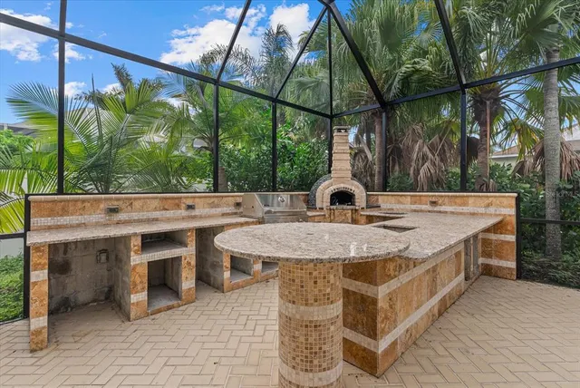 a view of a patio with couches chairs and potted plants