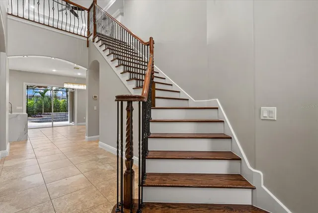 a view of entryway and hall with wooden floor