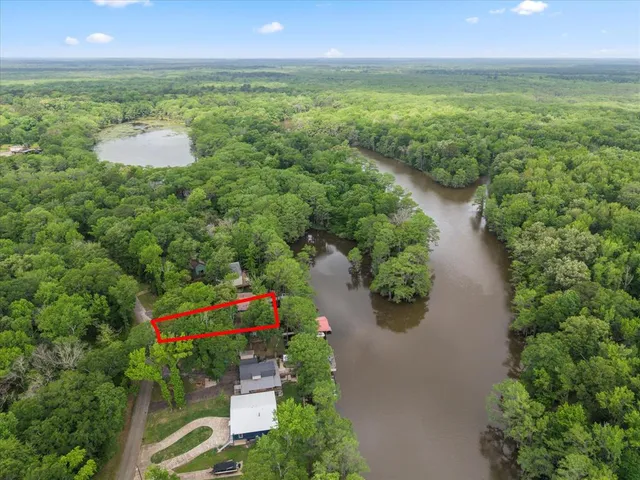 a view of a lake with a yard