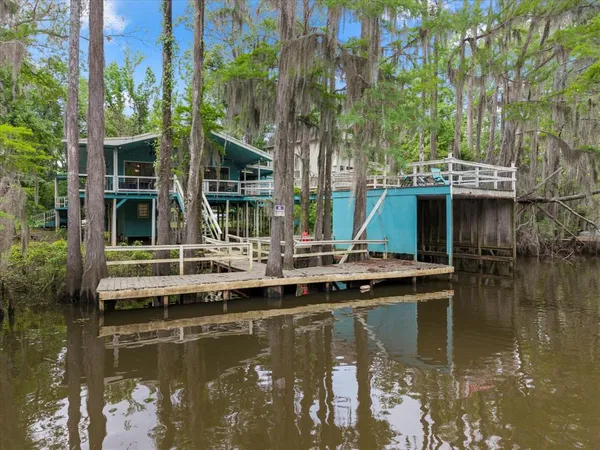 a view of house with swimming pool and outdoor space