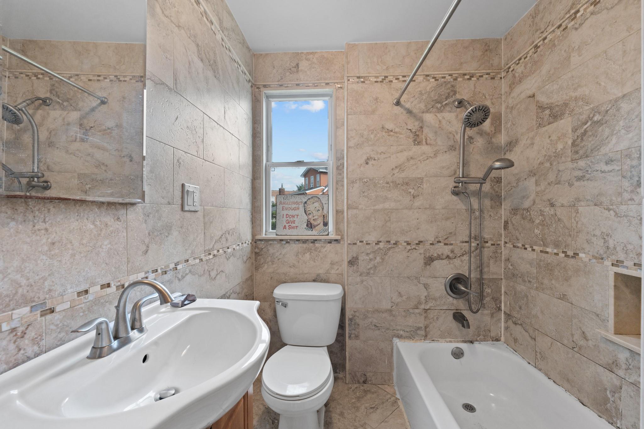 2445 Esplanade Bronx, NY 10469 - Photo 9 of 14 a bathroom with a toilet sink and shower