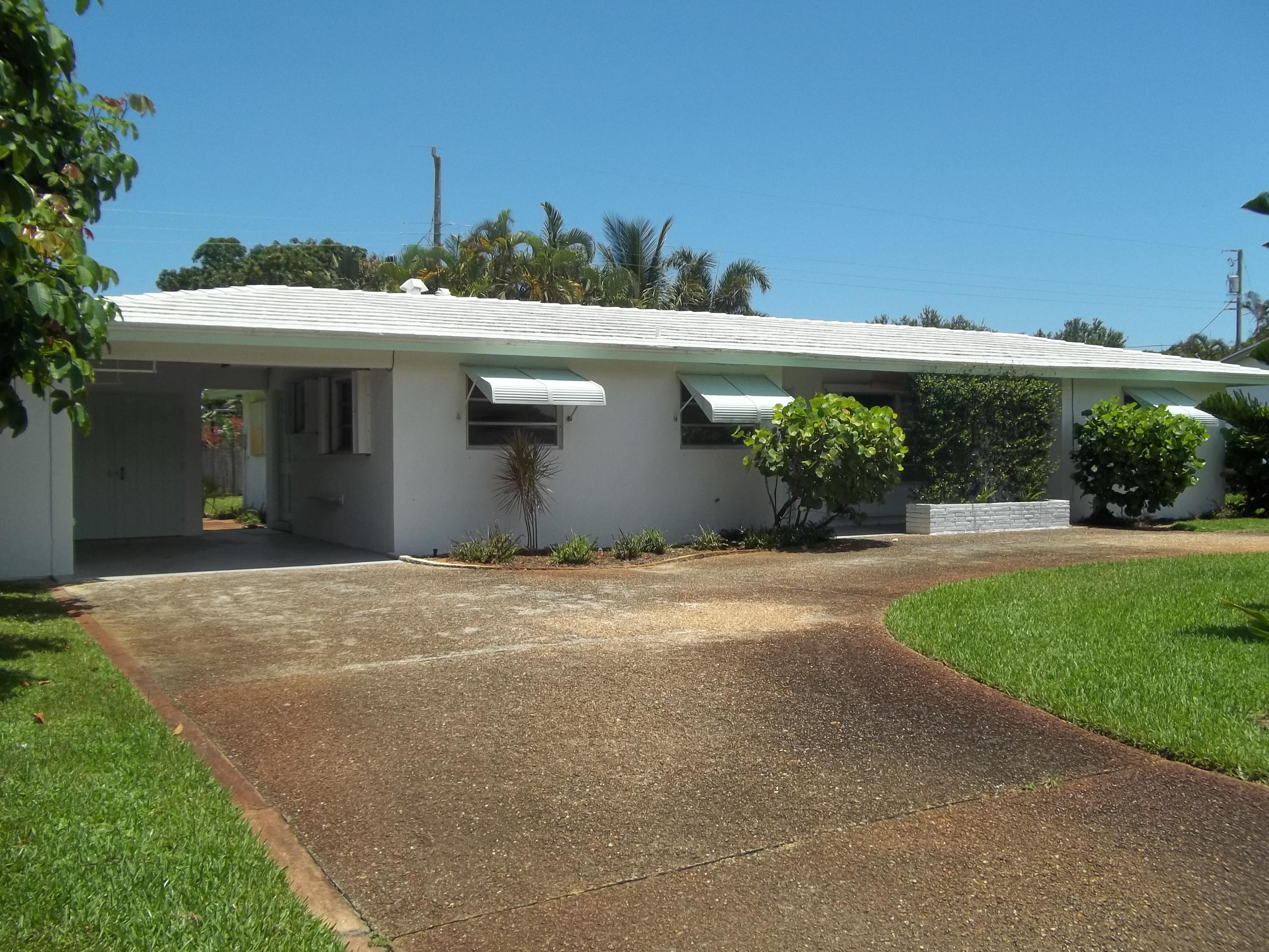 1509 Donald Road Jupiter, FL 33469 - Photo 2 of 19 Exterior Front with Carport