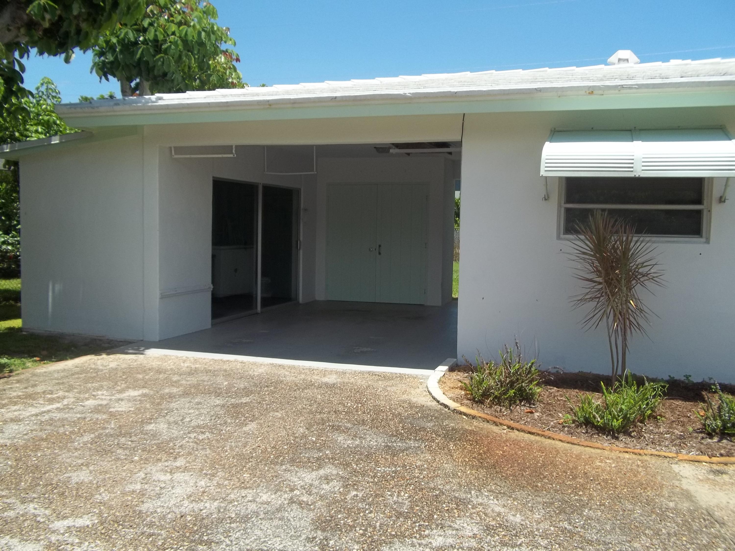 1509 Donald Road Jupiter, FL 33469 - Photo 3 of 19 Carport with Workshop/Storage Area