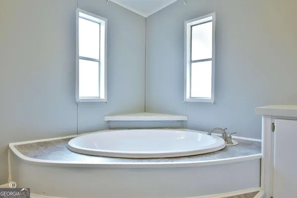a bathroom with a sink and toilet
