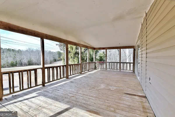 a view of a balcony with wooden floor