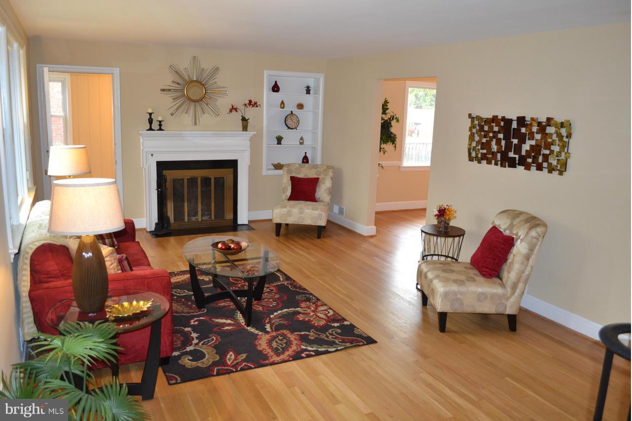 200 Indian Spring Drive Silver Spring, MD 20901 - Photo 4 of 30 Features hardwoods and fireplace.