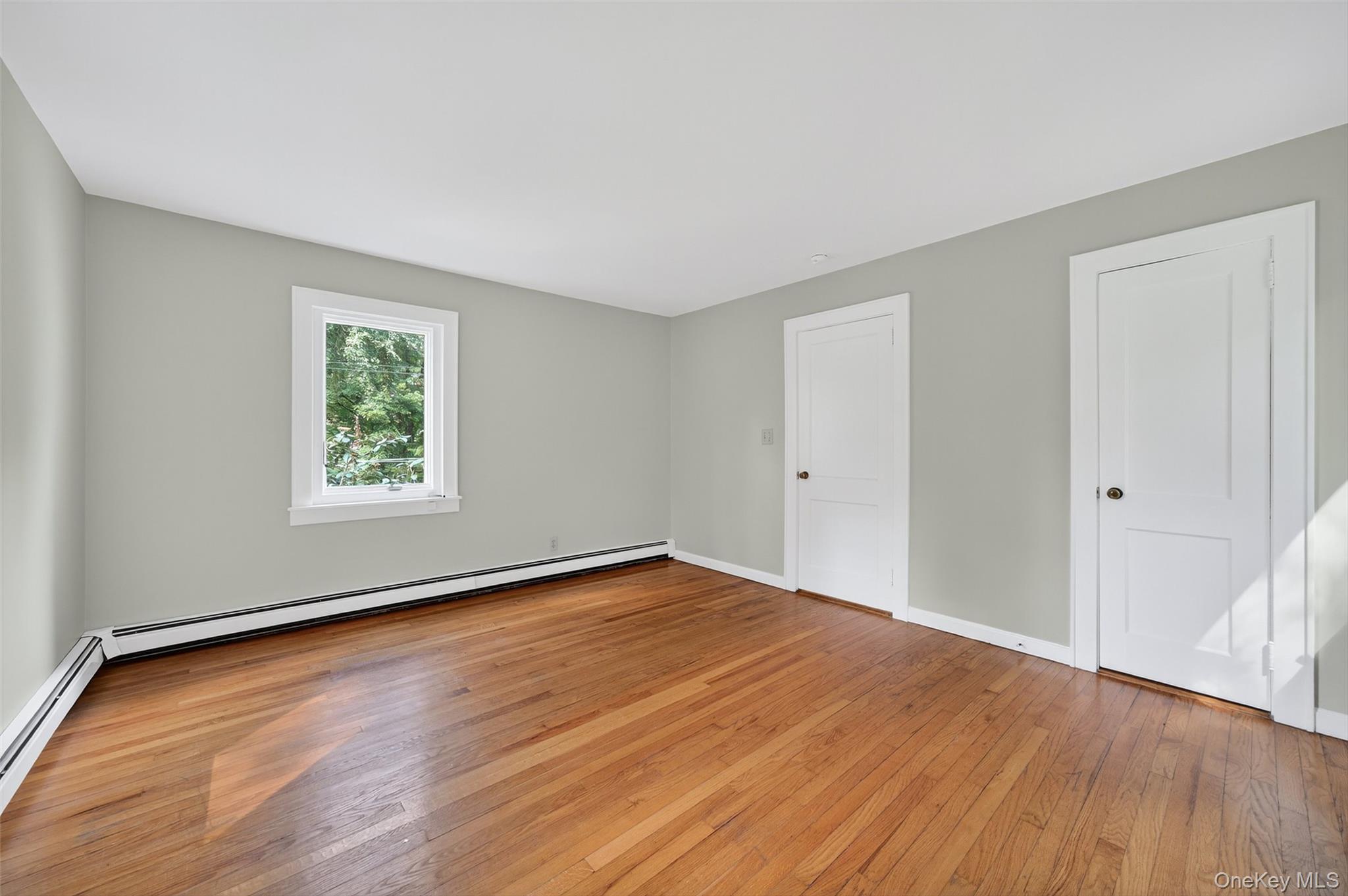 91 Sleepy Valley Road Warwick, NY 10990 - Photo 19 of 30 an empty room with wooden floor and windows