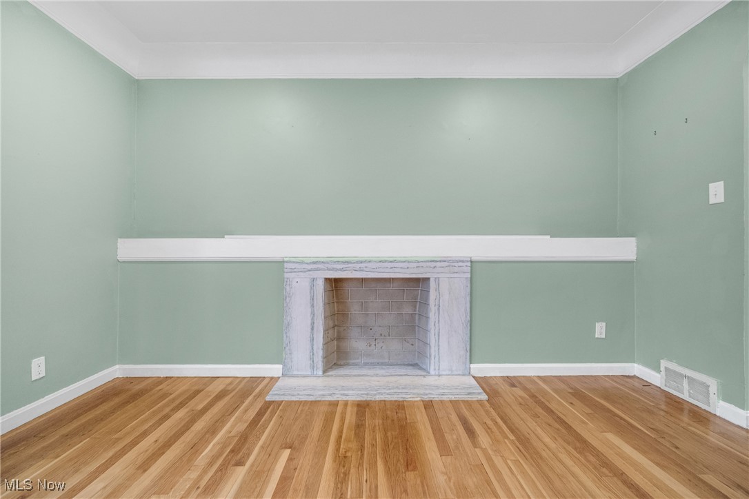 4430 Silsby Road Cleveland, OH 44118 - Photo 14 of 43 Room details with crown molding and hardwood / wood-style floors