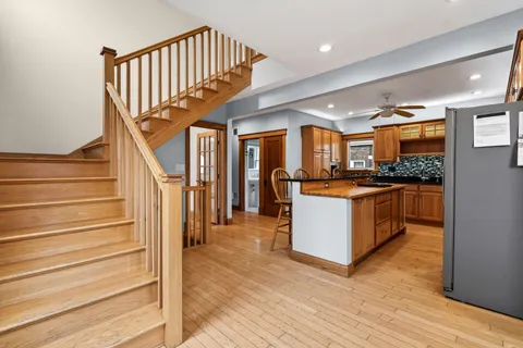 a view of kitchen with cabinets and wooden floor