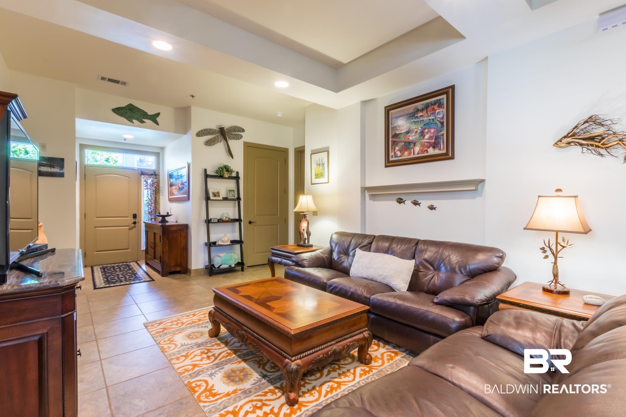 1430 Regency Road, Unit G103 Gulf Shores, AL 36542 - Photo 7 of 29 Tiled living room with a raised ceiling