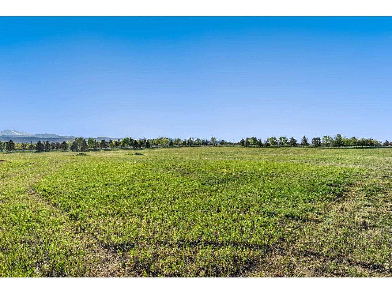 9715 Meadow Ridge Lane Longmont, CO 80504 - Photo 16 of 17 a view of a city with an ocean