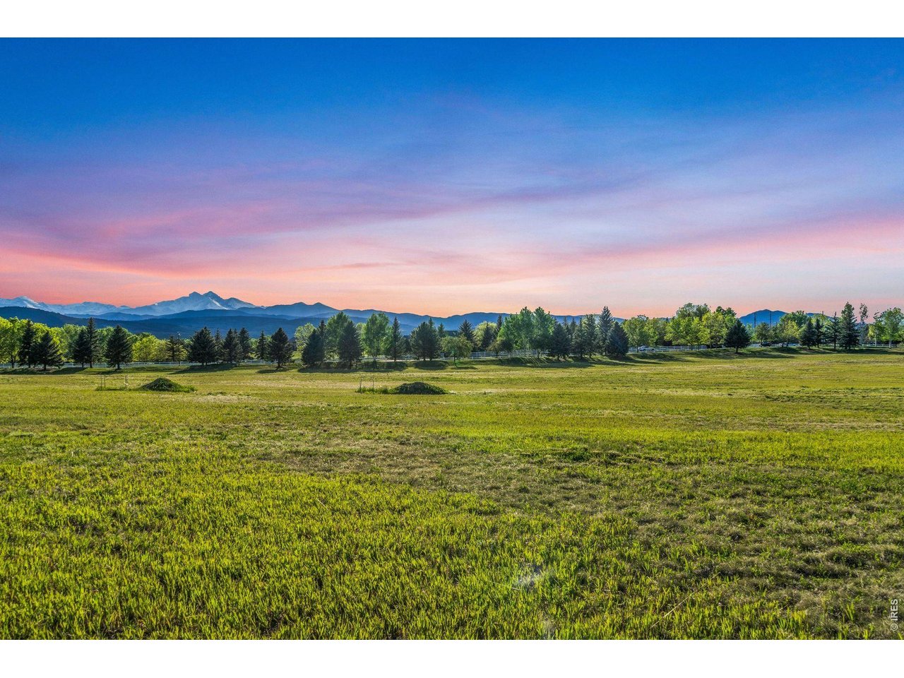 9715 Meadow Ridge Lane Longmont, CO 80504 - Photo 8 of 17 a view of a lake with a big yard