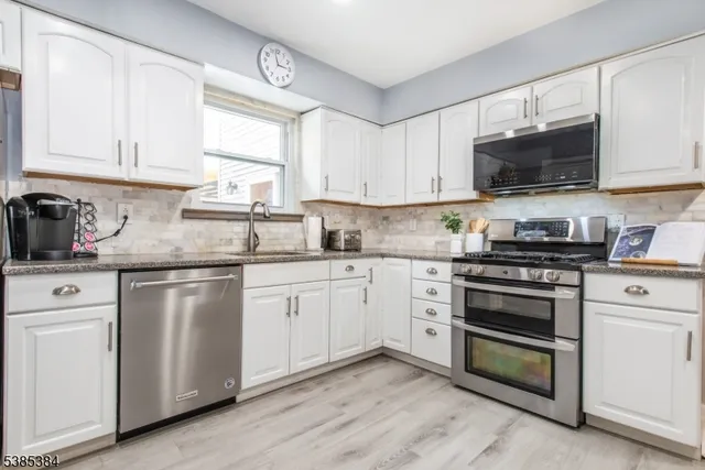 a bedroom with a bed and flat screen tv