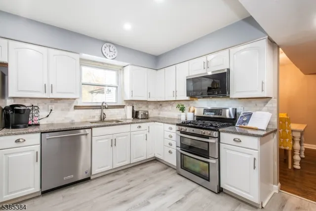 a spacious bedroom with a bed and a window