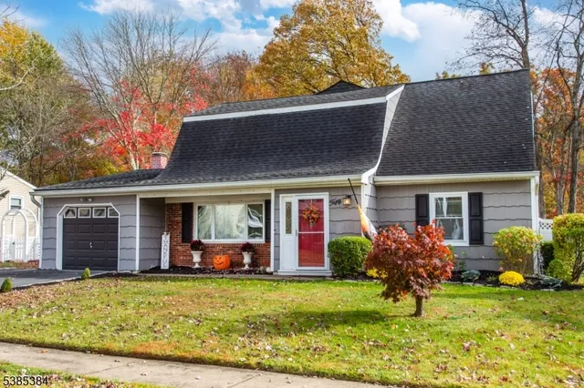 a view of a house with a yard and plants