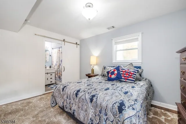 a room with a bed and a window