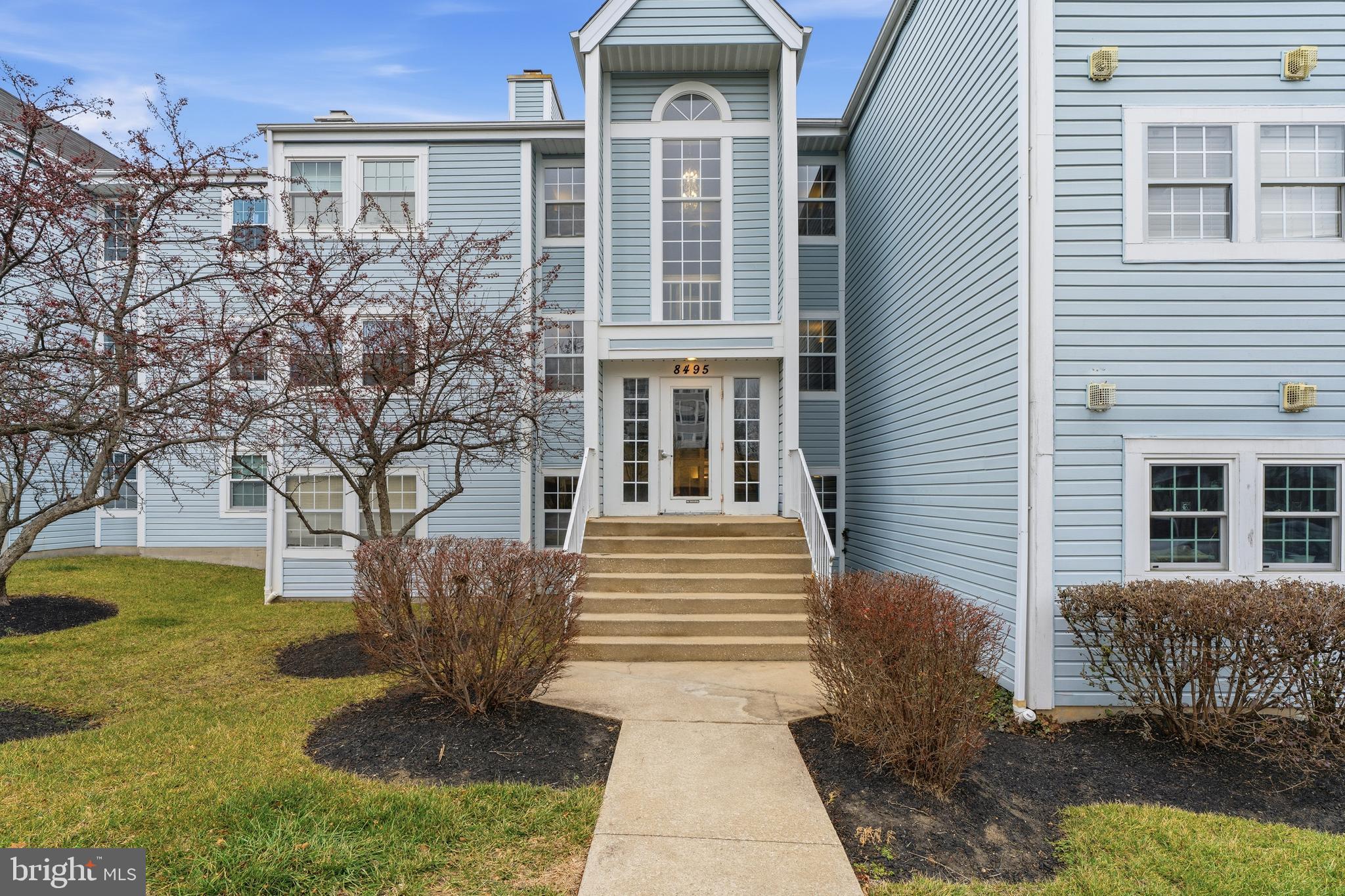 8495 Falls Run Road, Unit B Ellicott City, MD 21043 - Photo 1 of 34 a front view of a house with garden