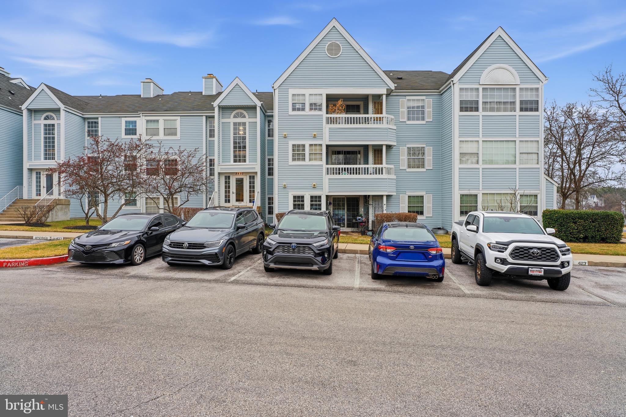 8495 Falls Run Road, Unit B Ellicott City, MD 21043 - Photo 2 of 34 a view of a cars parked in front of a house