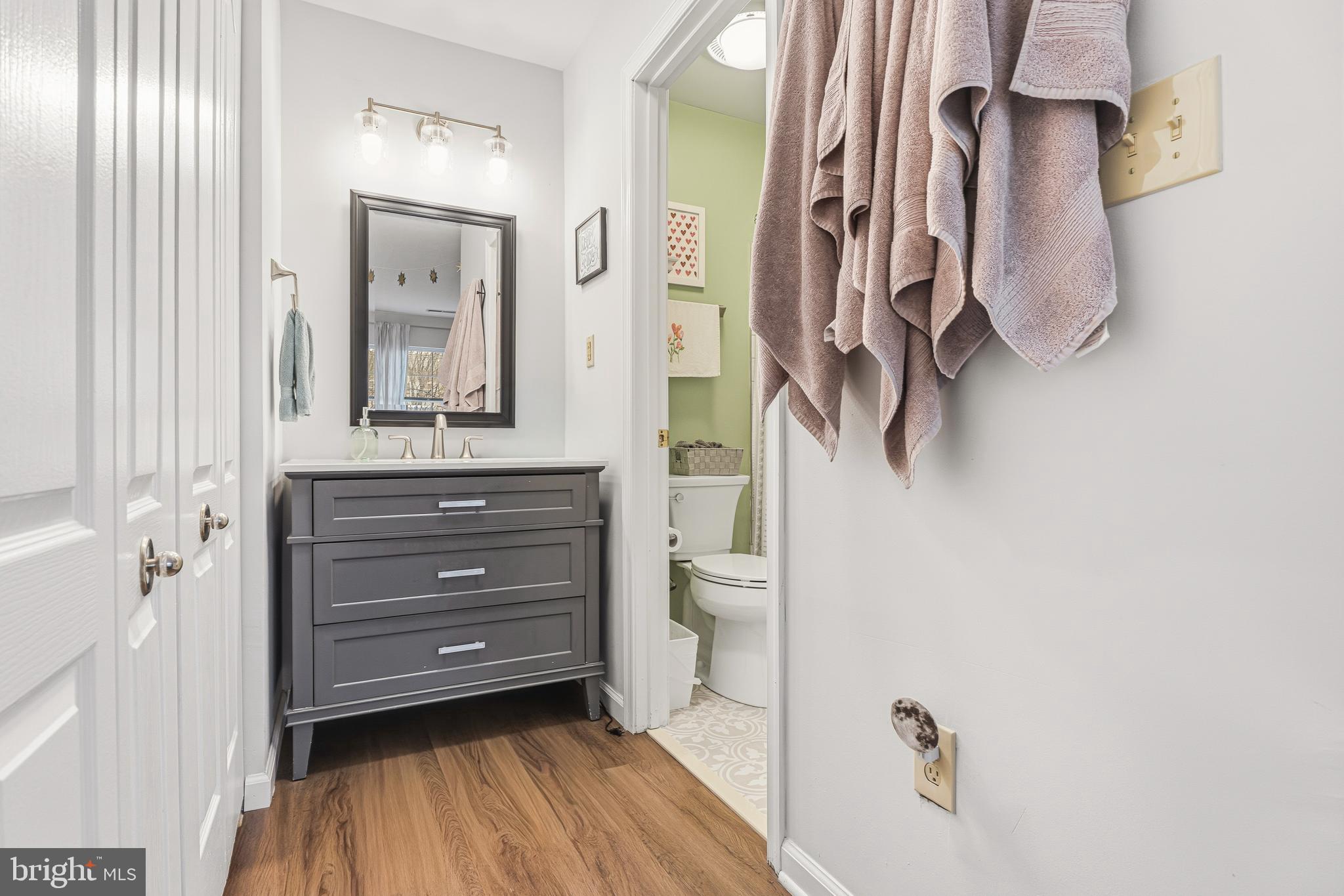 8495 Falls Run Road, Unit B Ellicott City, MD 21043 - Photo 23 of 34 a bathroom with a shower and a mirror