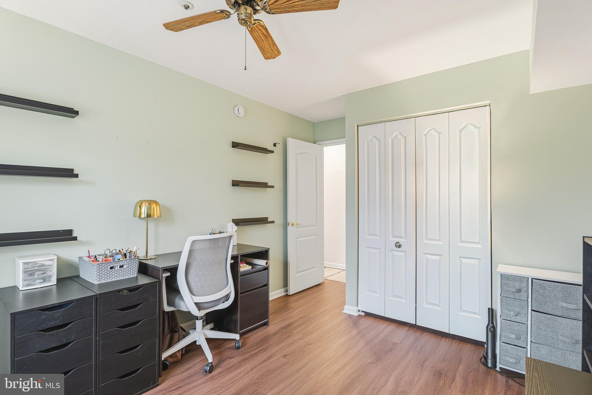 8495 Falls Run Road, Unit B Ellicott City, MD 21043 - Photo 26 of 34 a view of a workspace with furniture and wooden floor