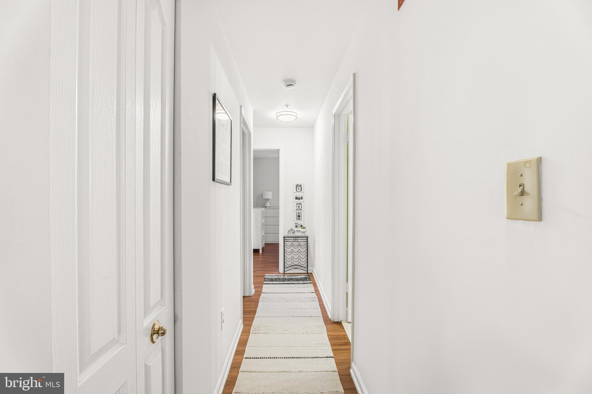8495 Falls Run Road, Unit B Ellicott City, MD 21043 - Photo 27 of 34 a view of a hallway with white walls