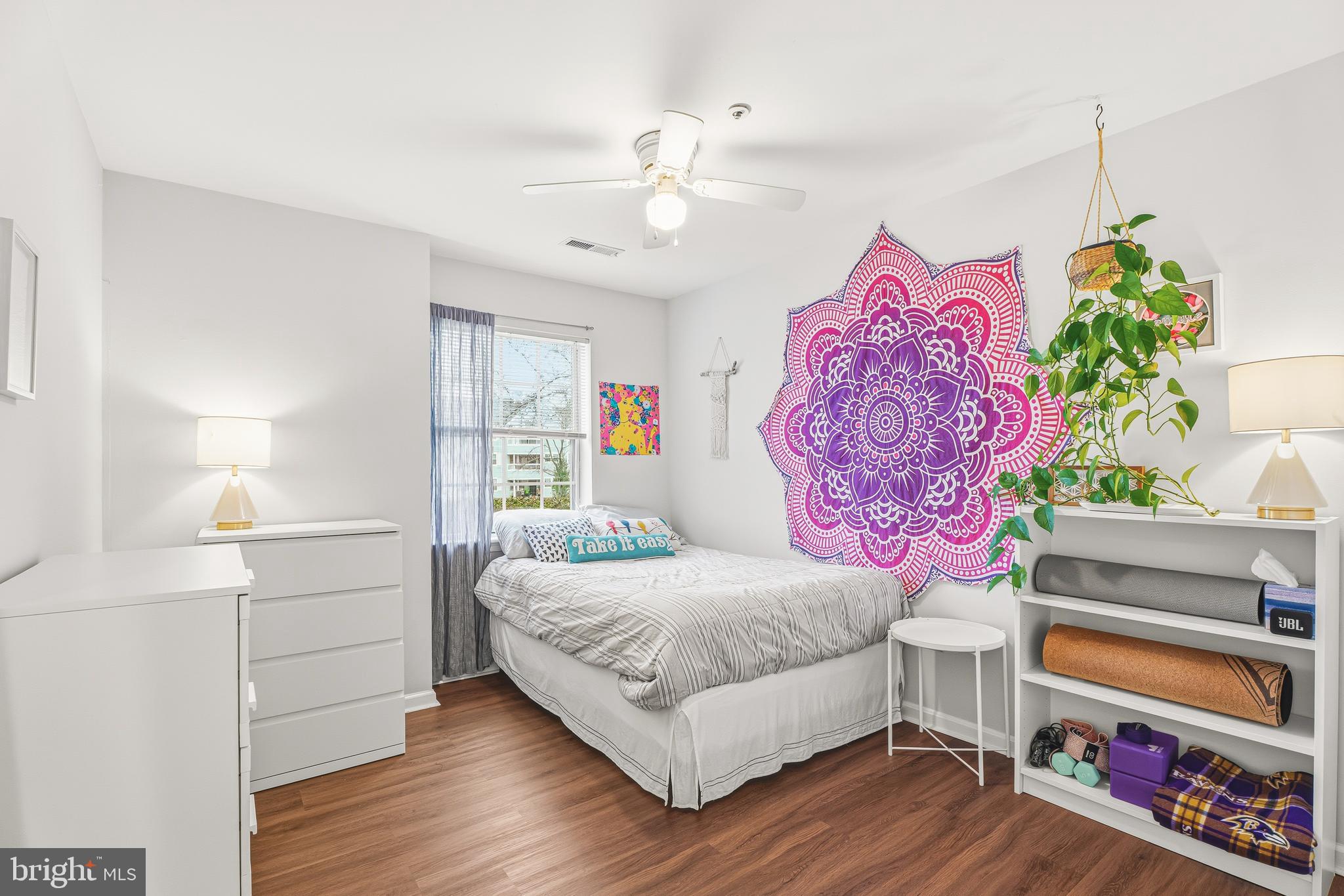 8495 Falls Run Road, Unit B Ellicott City, MD 21043 - Photo 29 of 34 a bedroom with a bed and a dresser in it