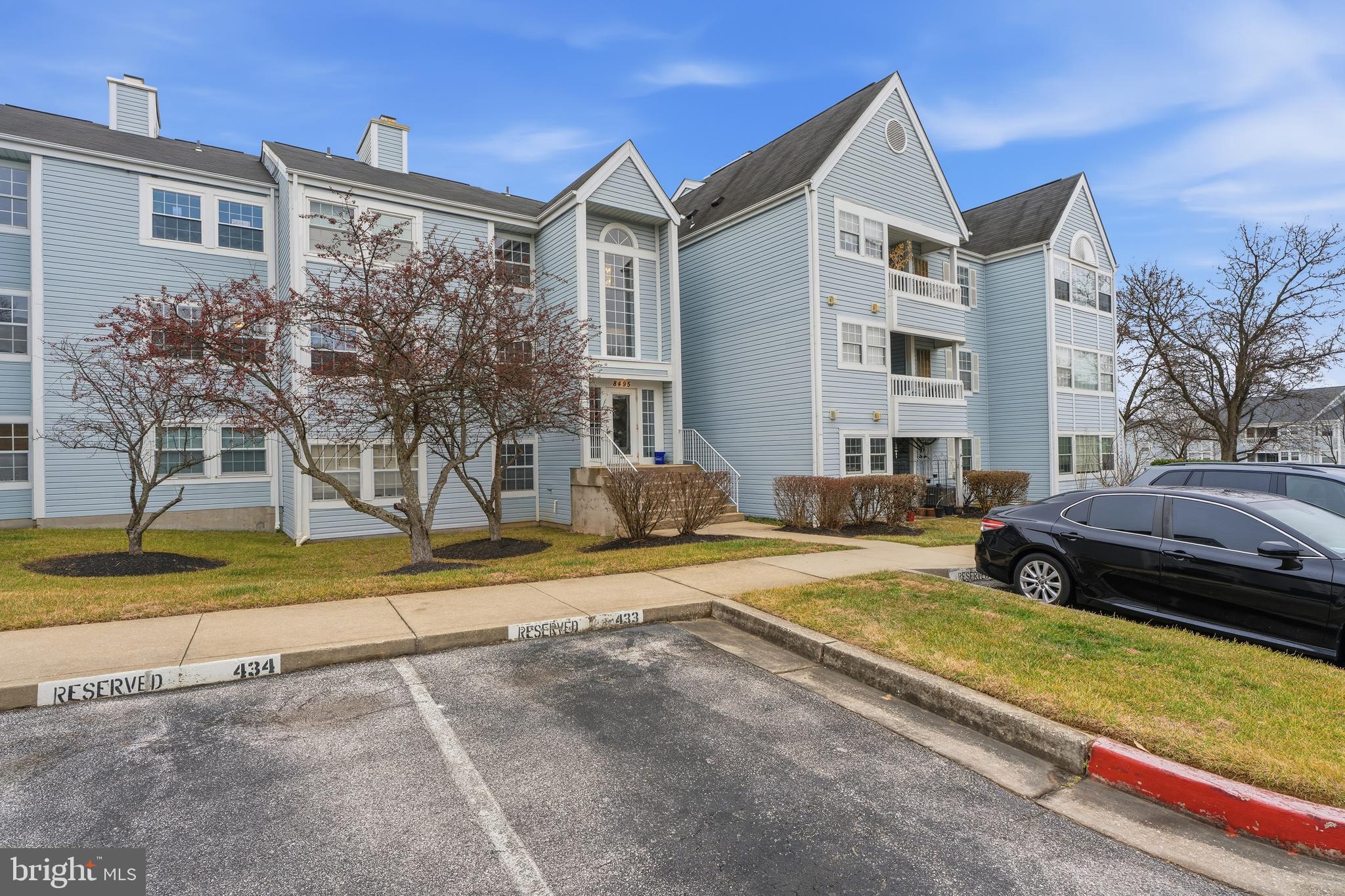 8495 Falls Run Road, Unit B Ellicott City, MD 21043 - Photo 4 of 34 a front view of a house with a yard