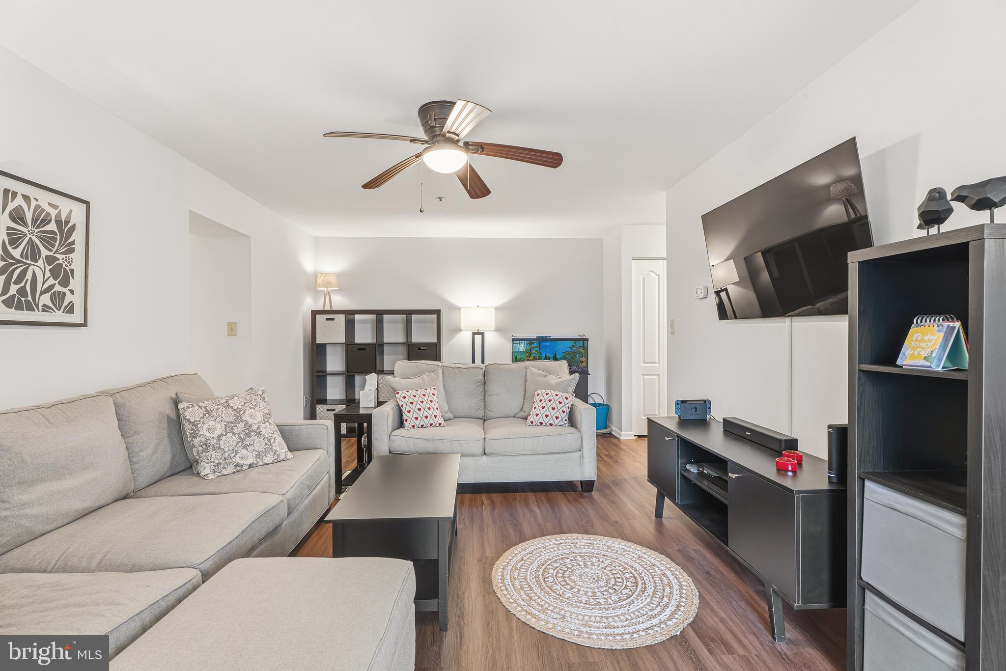 8495 Falls Run Road, Unit B Ellicott City, MD 21043 - Photo 8 of 34 a living room with furniture and a flat screen tv