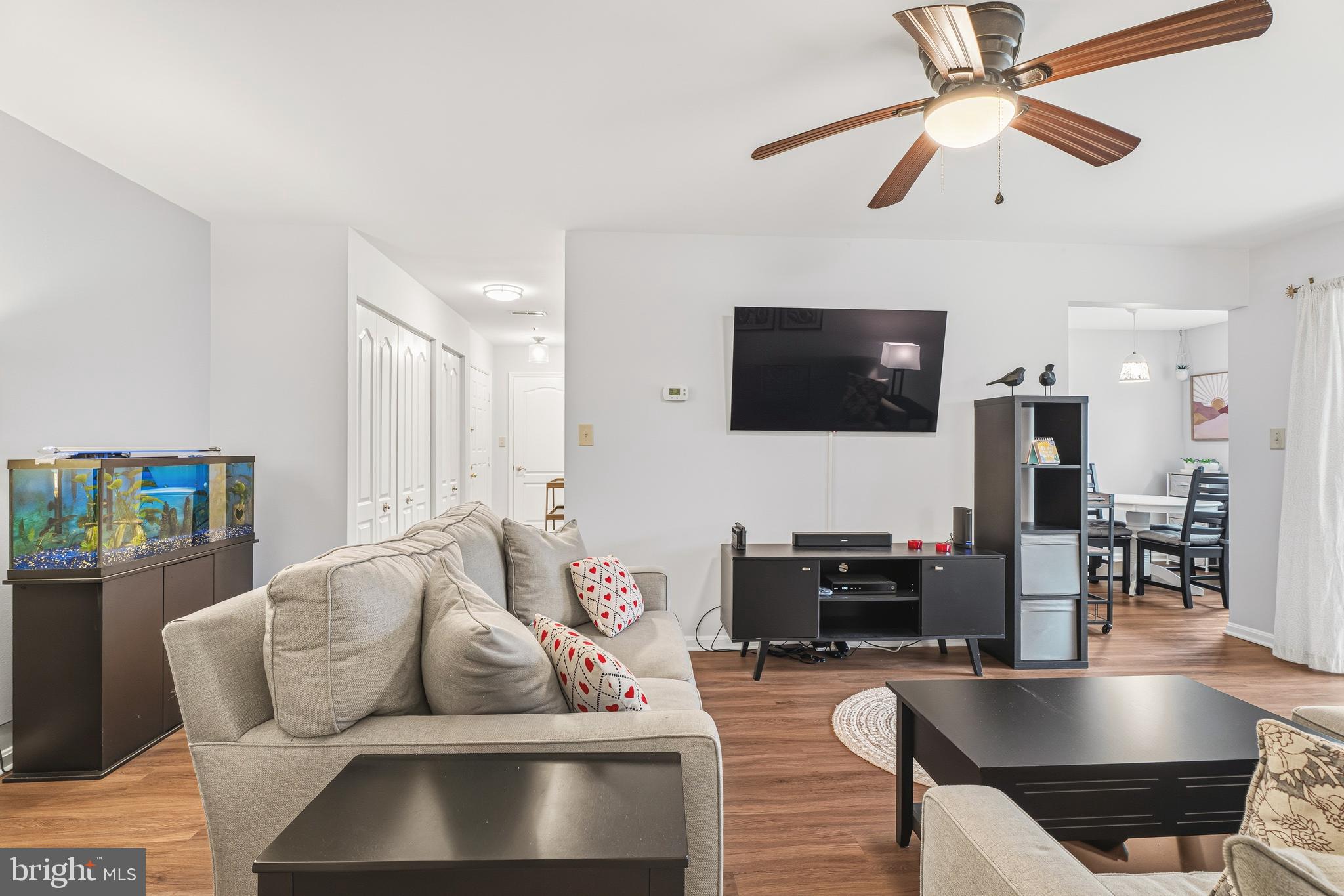 8495 Falls Run Road, Unit B Ellicott City, MD 21043 - Photo 9 of 34 a living room with furniture and a flat screen tv
