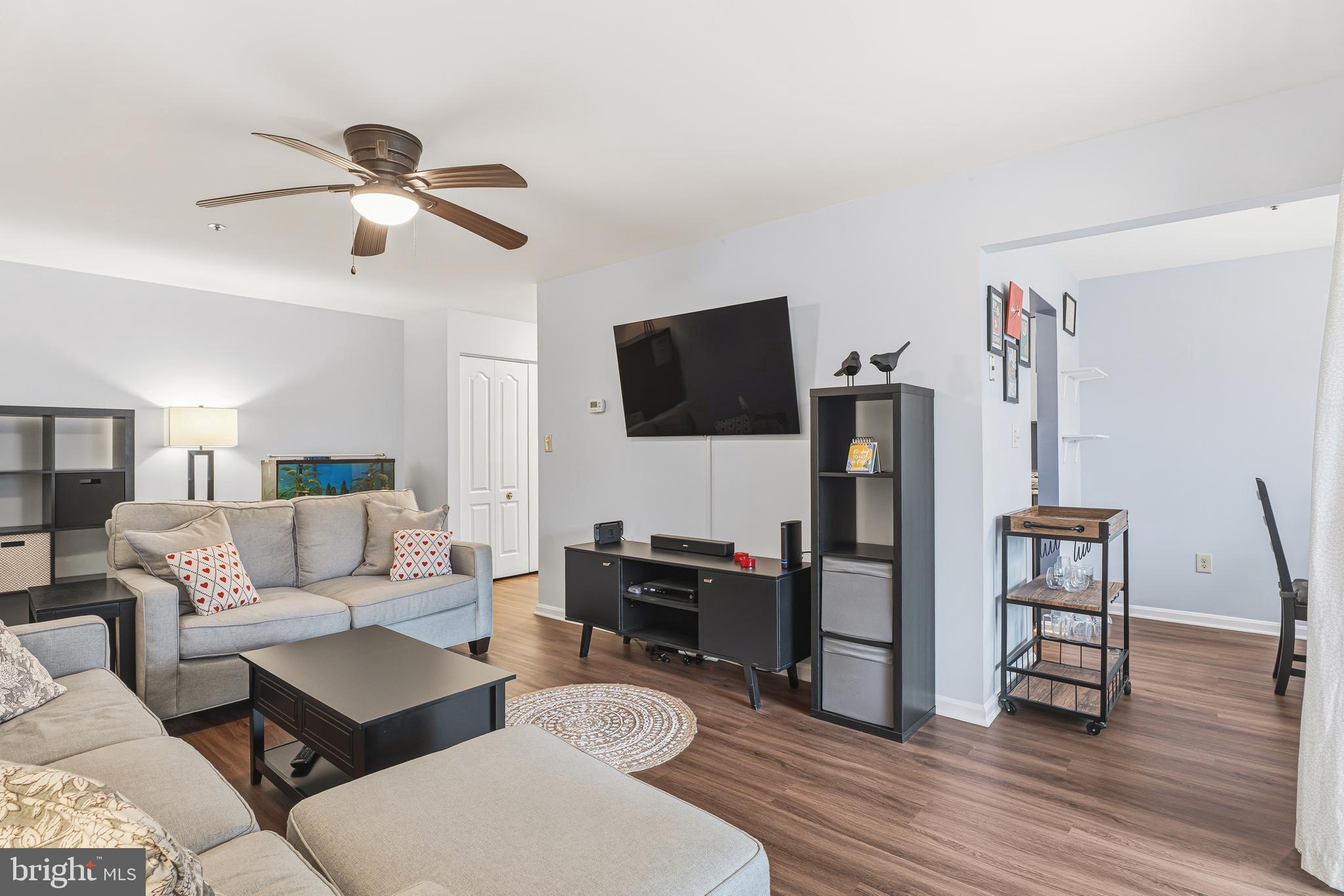 8495 Falls Run Road, Unit B Ellicott City, MD 21043 - Photo 10 of 34 a living room with furniture and a flat screen tv