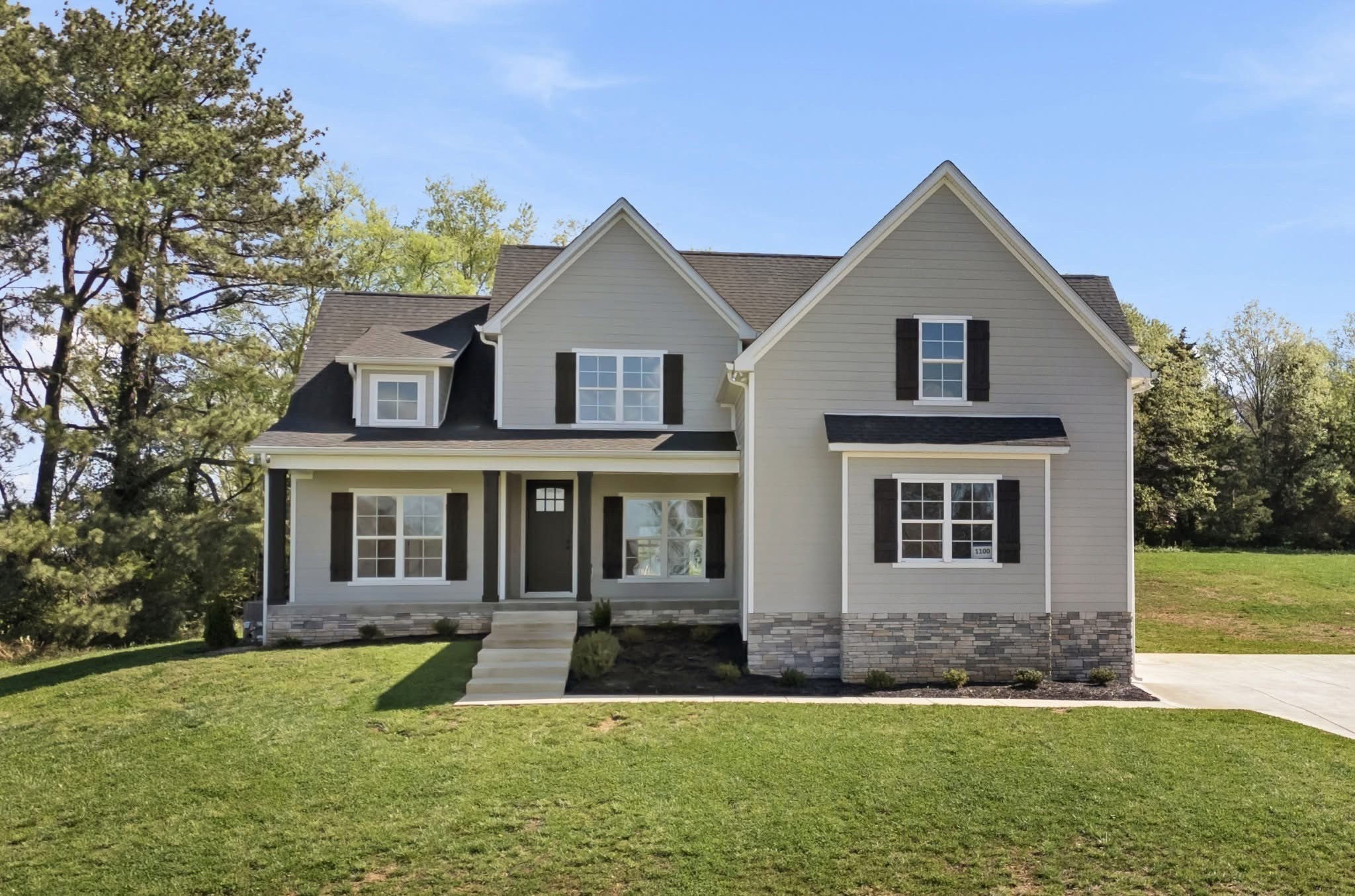 front view of a house with a yard