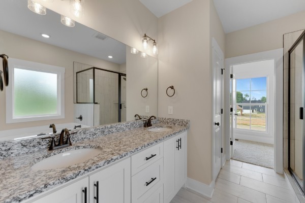1100 Goose Drive Springfield, TN 37172 - Photo 10 of 19 a bathroom with a granite countertop sink double and mirror